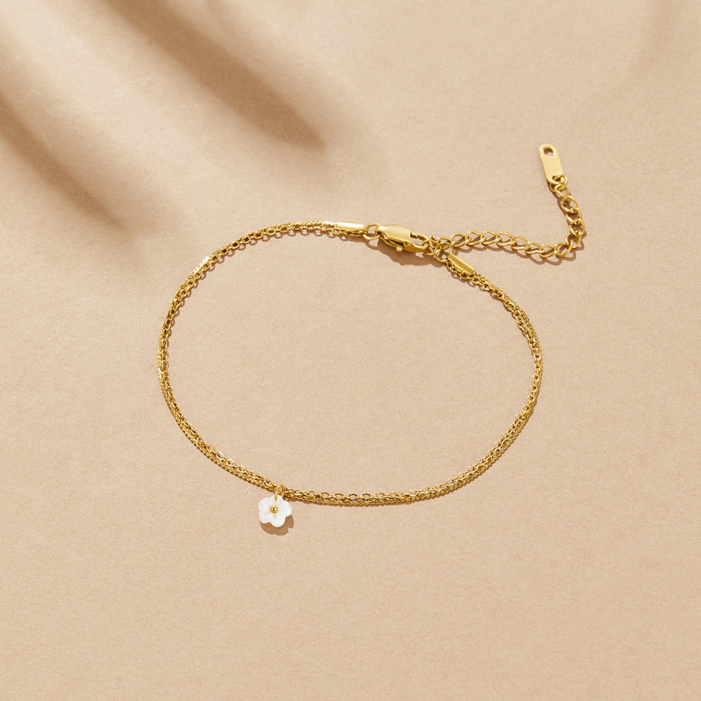 Bela cvetna školjka plastnata anklet